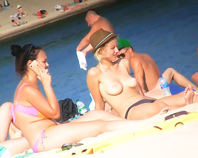 Same voluptous teen leave the plage in very see through clothes. I think she look very sery so!. 2