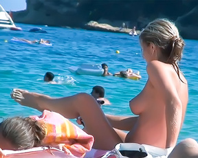 Barely legal naturist babe lights up at the beach 3