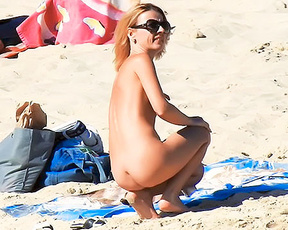 Wife sunning on the beach ! Who wants to see the video? wow