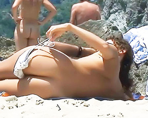 Down at the beach this two pretty  girls were having a sunbath. The reading one was specially insatiable. 2