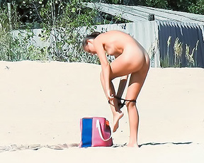 My wife with no bikini in the beach
