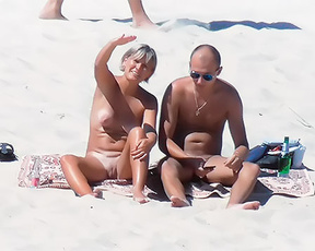 Nude Beach Couple Sitting on a Patterned Towel
