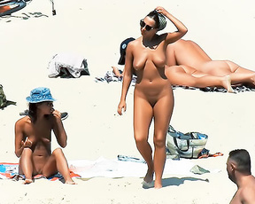 Four Nudists Gathered on a Sunny Nude Beach