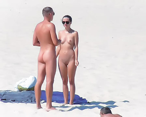 Standing and Sunbathing Together at a Nude Beach