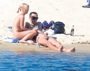 Nude Beach Couple Resting Together by Calm Water
