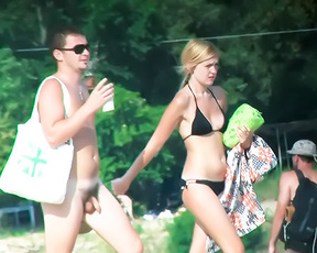 Four Naturists Walking and Posing by a Lakeside Beach