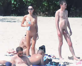 Standing on a Nude Beach Holding a Spray Bottle