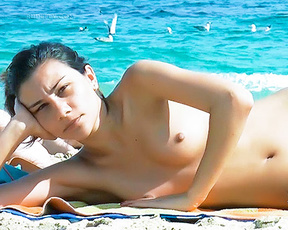 Stripped To The Waist Damsel Strolling The beach