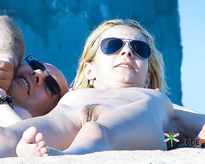 Nude Beach Couple Resting Together on Warm Sand