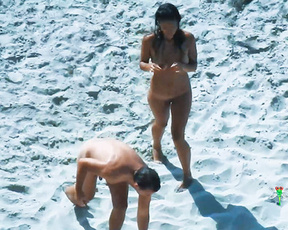 Sunbathing and Standing on a Bright Sandy Nude Beach