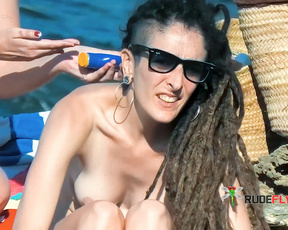 Applying Sunscreen Topless on a Rocky Topless Beach
