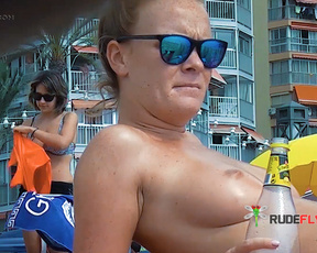 Blissful Beachgoers Relaxing Bare-Topped at Ibiza 7