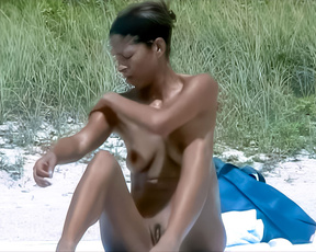 Sitting on the Sand at a Nude Beach Beside Tall Grass