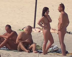 Slim girl with perky boobs naked at a nudist beach 3