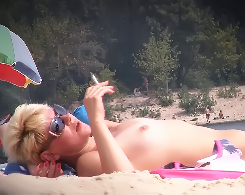 Busty lady shows her naked body at the nude plage 2