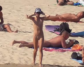 Nudist girls have fun with each other at the beach 5