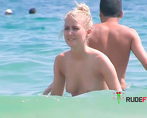 Gorgeous young nudist babe have fun fooling around at the nude beach 2