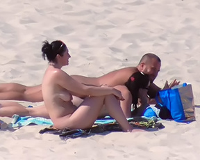 Adorable nude beach girl caught on camera with her big, natural tits out