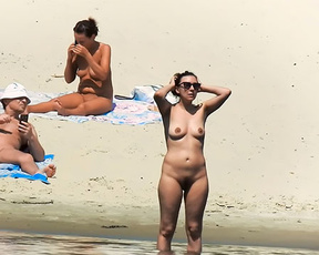 Nude beach girl filmed enjoying a sunny day at the beach 2