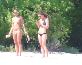Sexy young nudist chicks caught on the beach on a hidden cam