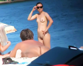 Young nudist girls loves hanging around on a beach with her naked friends.
