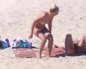 Nudist plage, close to this couple. Enjoying how the wife turned and softly showed her nice pussy.