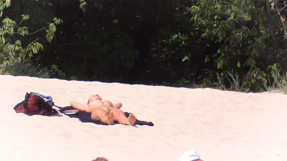 Would you like to spy on nude people on a beach?