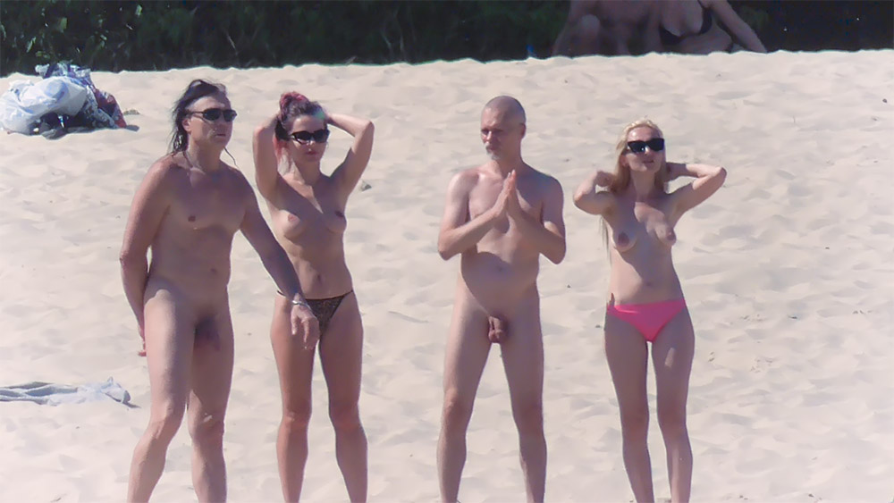 Nude beach girl filmed enjoying a sunny day at the beach