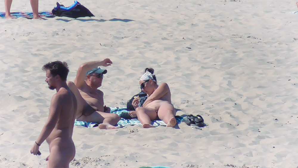Nude Beach Couple Resting on a Patterned Towel