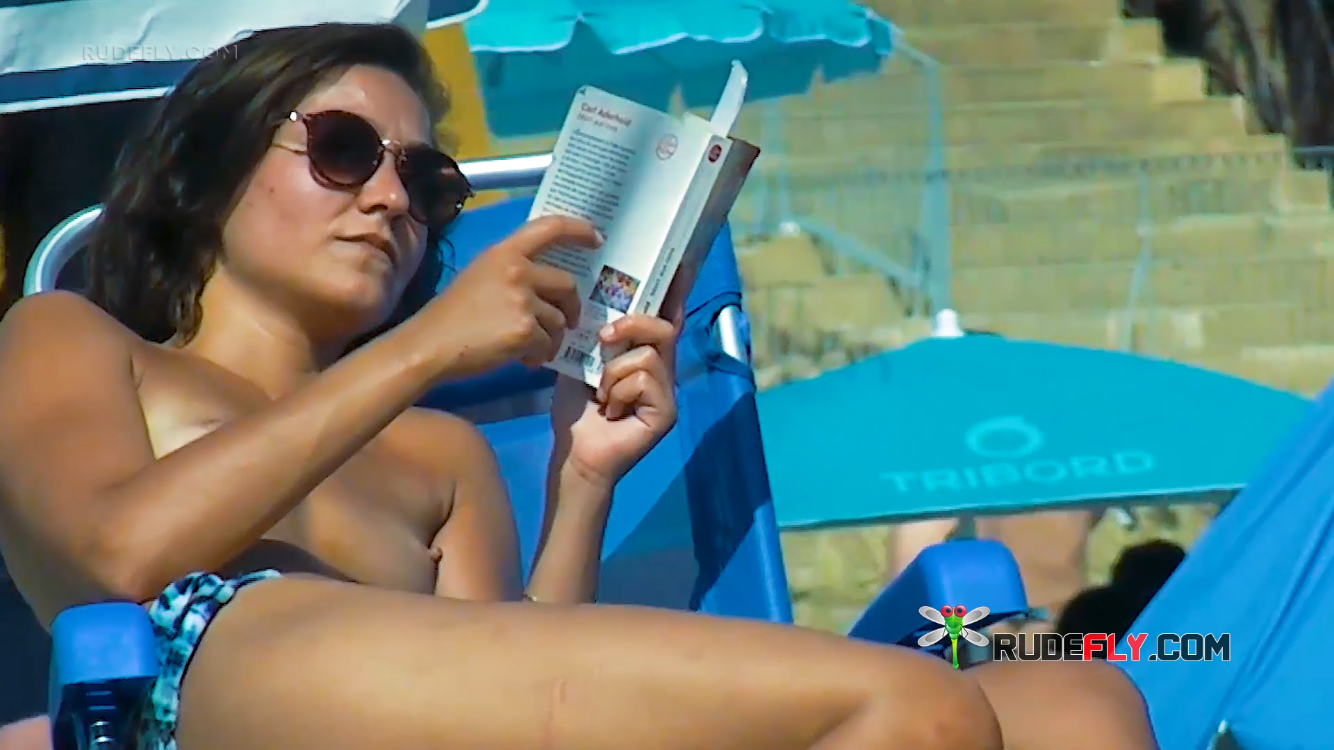 Harmonious Vacationers Basking in the Sunlight Relaxing Topless on Andalusian Coast Beach 2