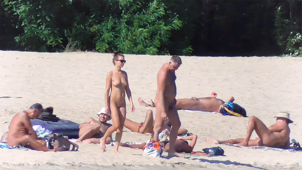 Five Nudists Gathered on the Open Sand