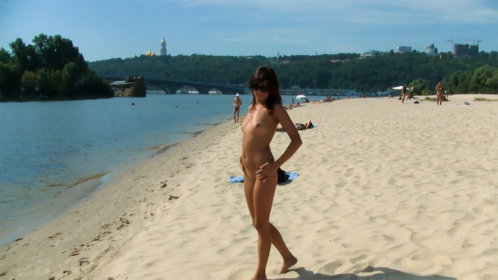 Sensual young nudist hotties secretly filmed by a voyeur having fun outdoors