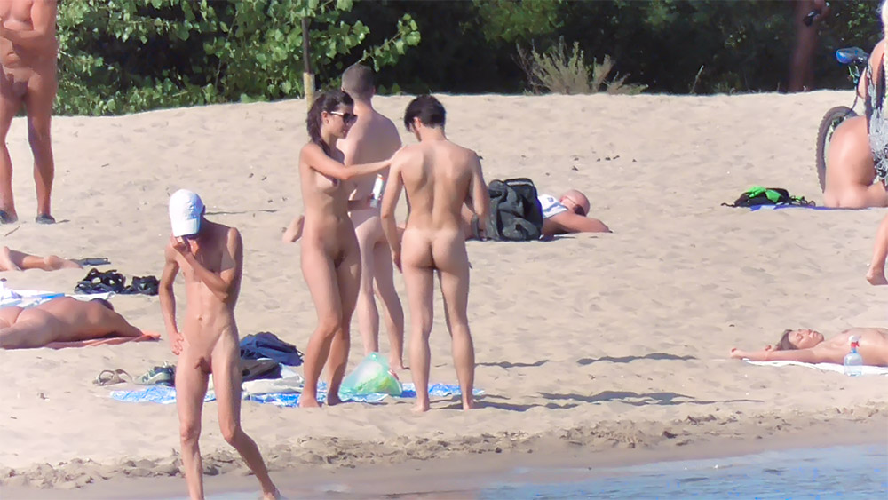Curvaceous nude beach girl caught by a voyeur on a hidden camera