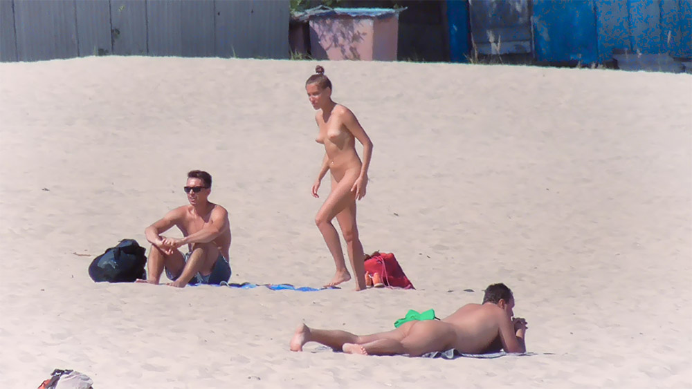 Beautiful chicks have fun on the beach and don't care about being recorded