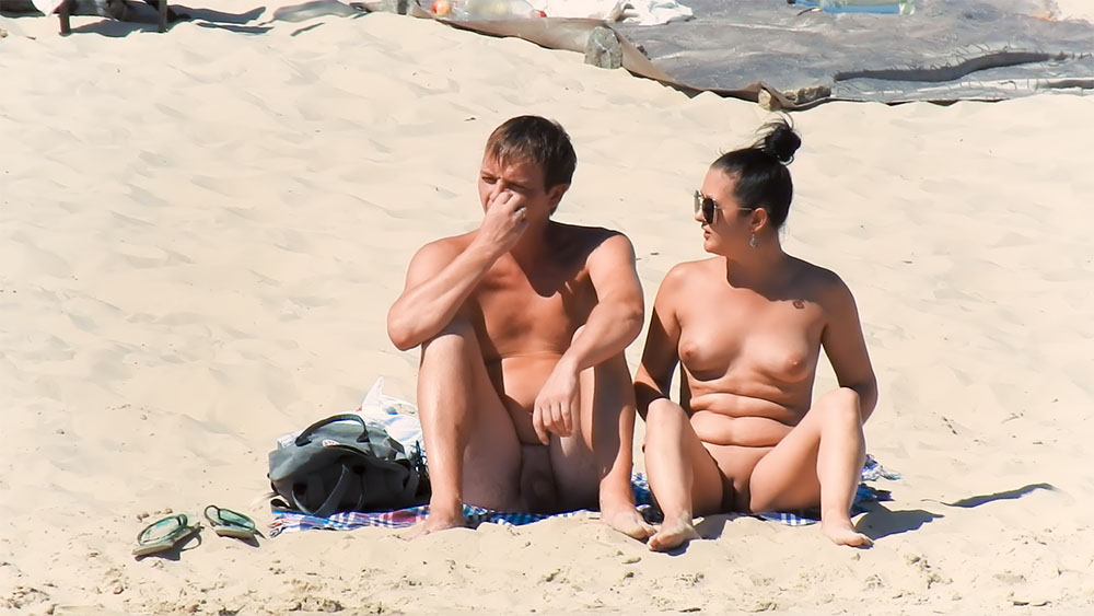 Nude Beach Couple Resting on a Checked Towel