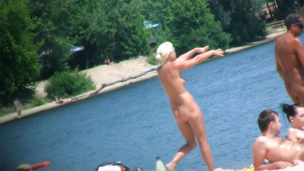 Rocky Shoreline Nudist Beach Walk in a White Swim Cap
