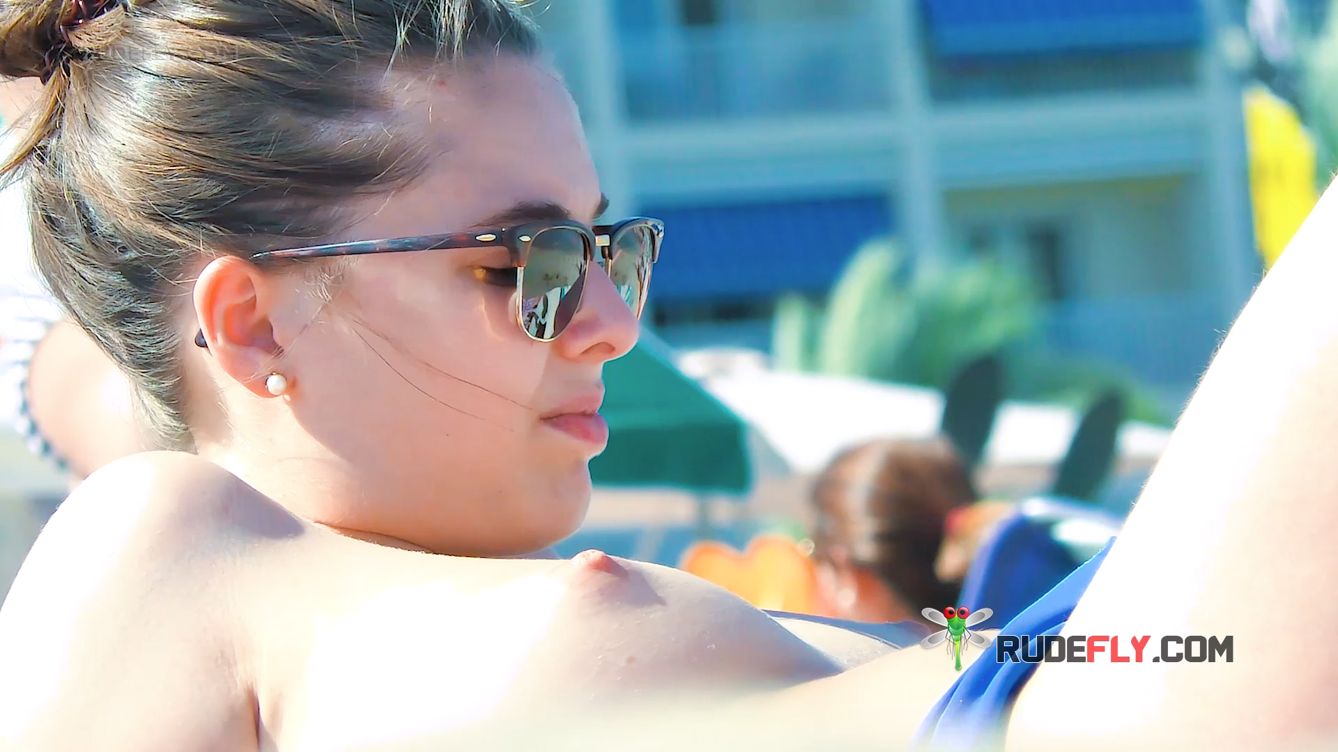 Sunbathing Topless Beach Style in Blue Bikini Bottoms