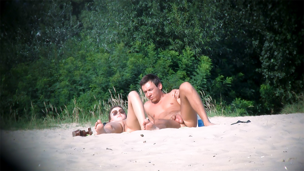 Quiet Dune-Backed Nude Beach Spot with a Resting Couple