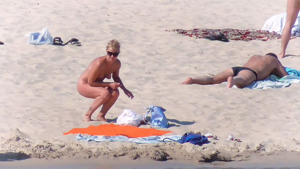 Orange Towel and Blue Bag on a Quiet Nude Beach