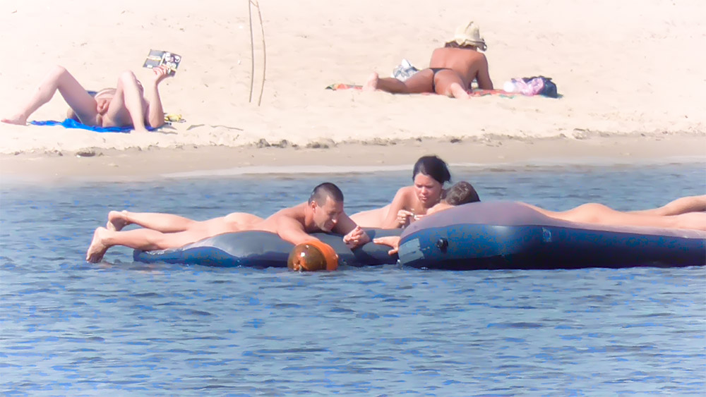 Funny scene at the beach, at least her friend had a really good time!. 3