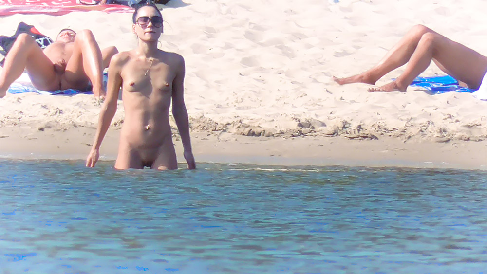 Nude Beach Bather Wading at the Shoreline