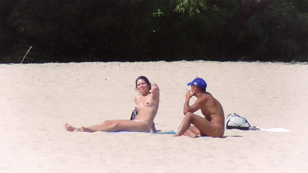 nude and showing everything at the beach in hk as some guys watched.