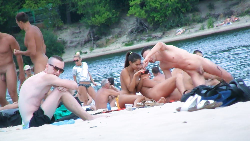 Five Nude Beach Bathers Resting Near Snorkeling Fins