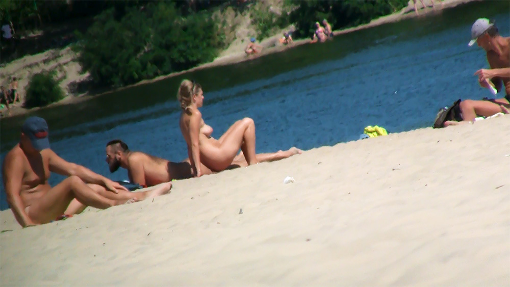 Leaning Back on the Sand at a Nude Beach