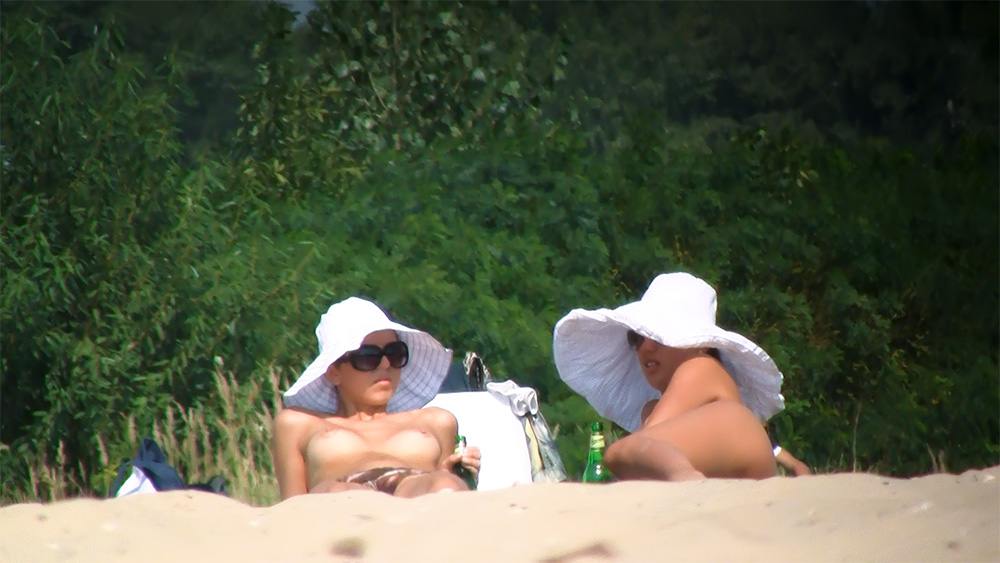 My sexy wife showing her pussy on a naturist beach