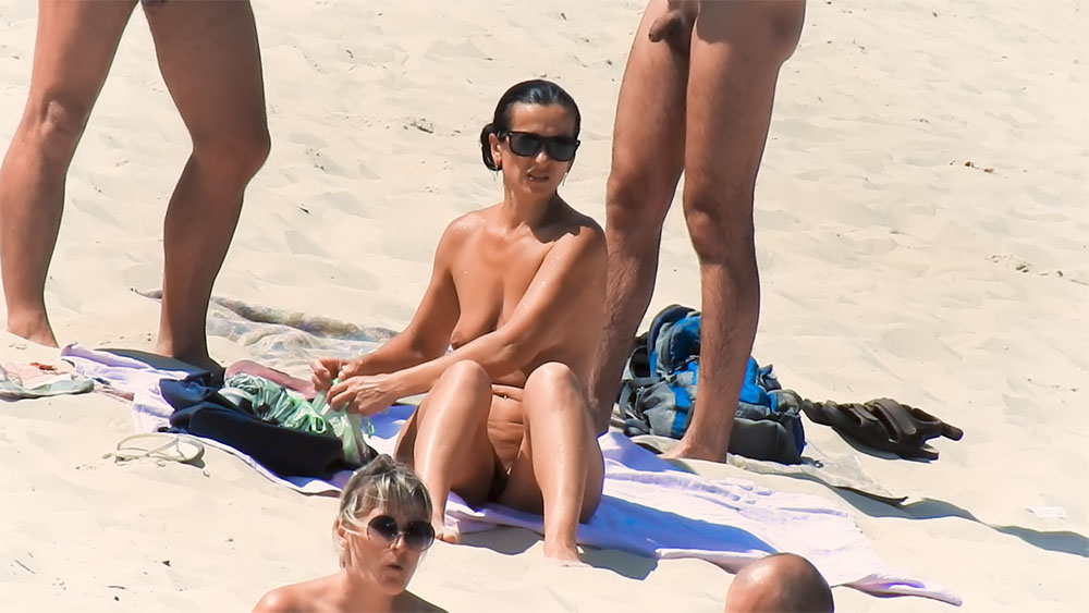 Some movies with me sunbathing nude on a regular beach with clothed peoples around.