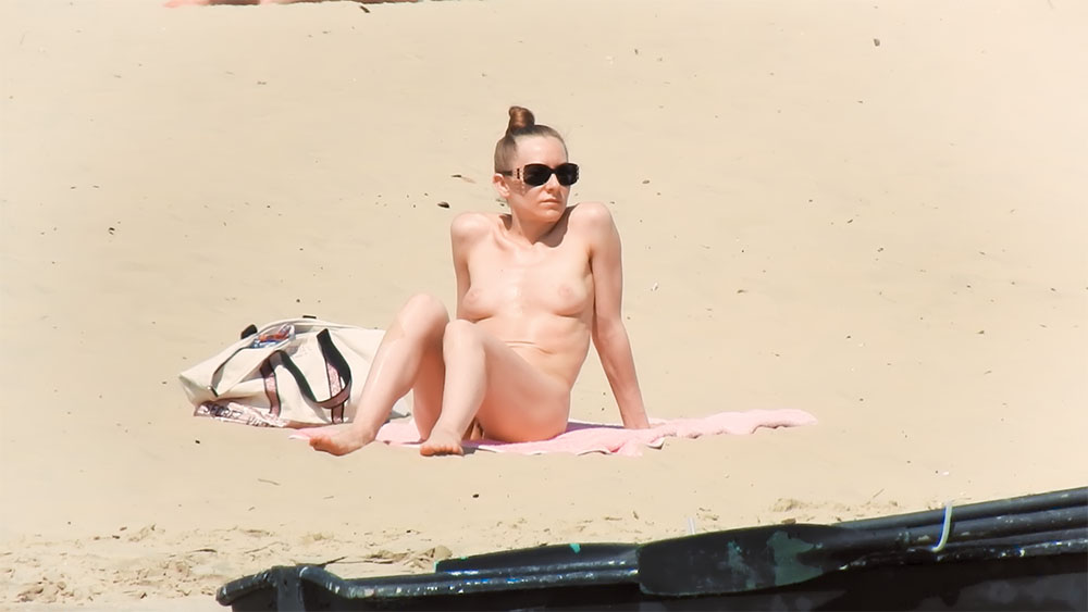 Sandy Topless Beach Towel with Tote Bag Beside Her