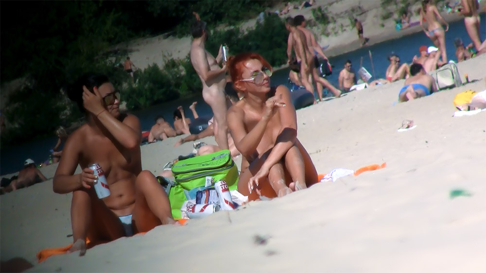 Sitting with a Green Cooler on a Nudist Beach