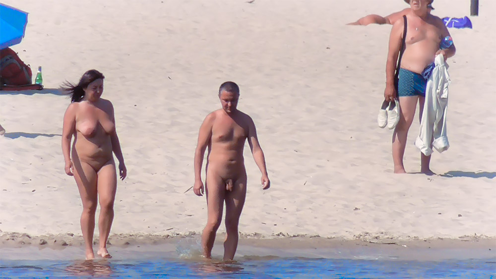 Nude Beach Couple Stepping onto Wet Sand