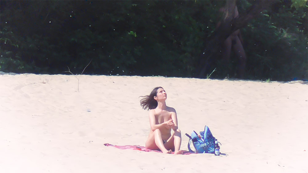 Sexy nudist teen enjoys the sun on the beach